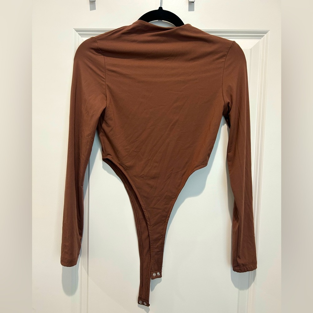 Reoria chocolate brown women’s bodysuit, size small, fitted, never worn